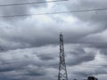 A circle of clouds over a tower of light in village in India